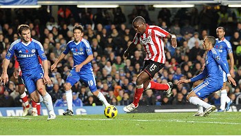 Nedum Onuoha waltzes through the Chelsea defence